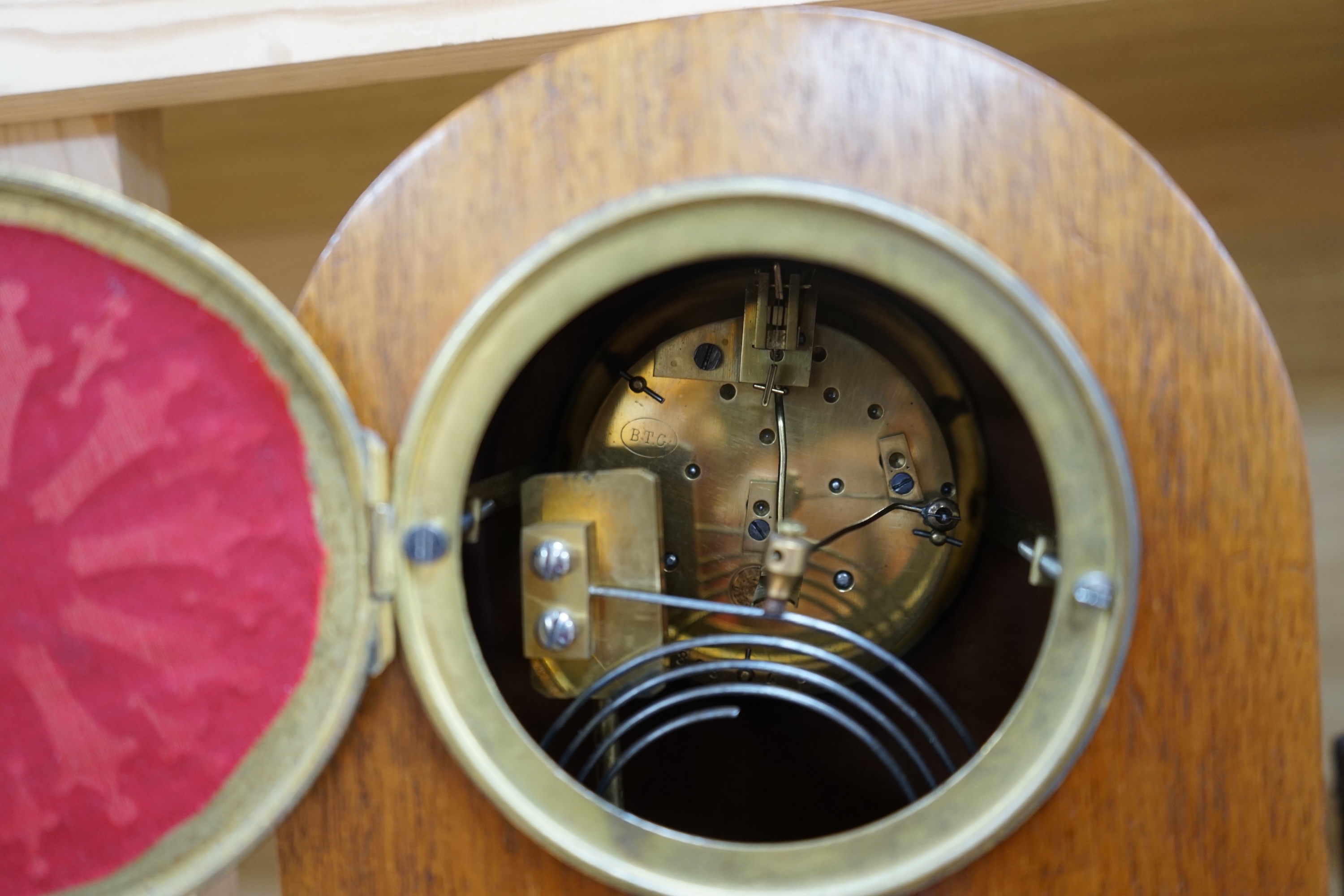 A cased brass carriage timepiece and a dome topped Edwardian mantel clock striking on a coiled gong, backplate stamped BTG, 29.5cm (2) Condition - fair to good.